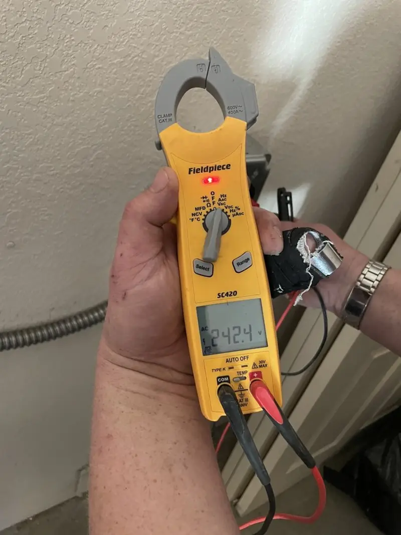 Voltage testing with clamp meter during Recessed Lighting Installation in Upper Southampton
